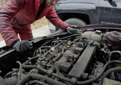 this image shows spark plugs and ignition coil in Garland, TX